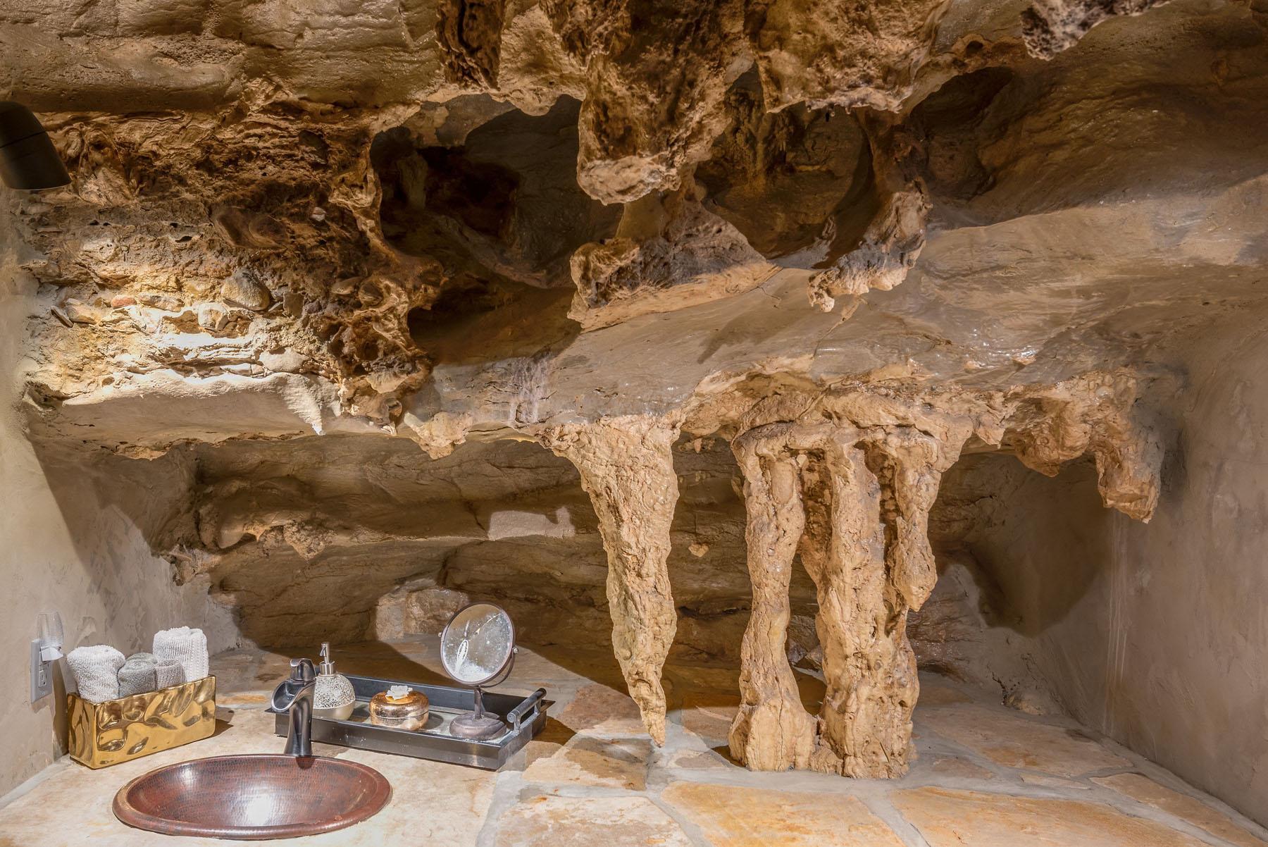  Stalactites hang from the ceiling in one of the cave's deluxe bathrooms